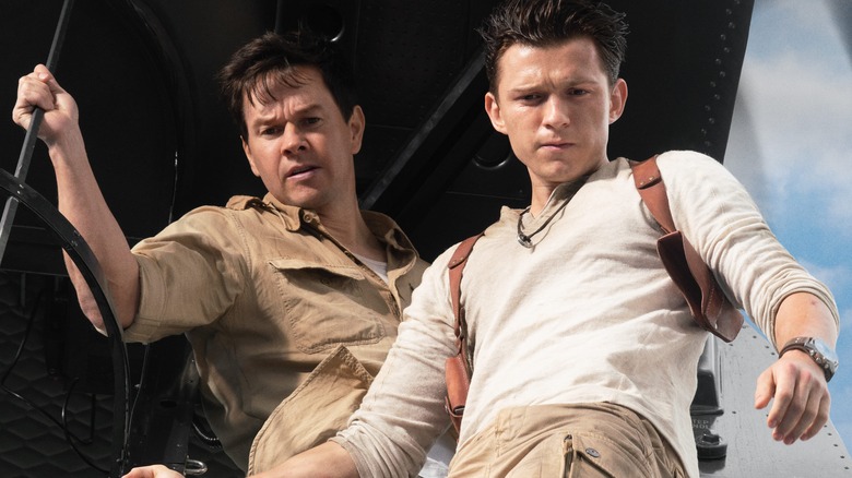 Mark Wahlberg and Tom Holland looking down