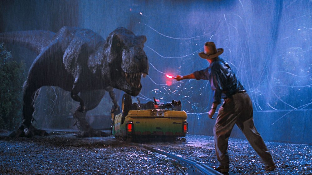 (from left to right) T-Rex, Sam Neil in Jurassic Park