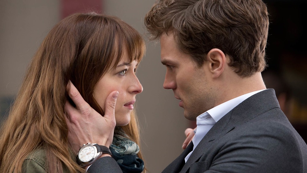 (from left to right) Dakota Johnson and Jamie Dornan in Fifty Shades of Grey