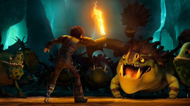 Hiccup facing off against dragons