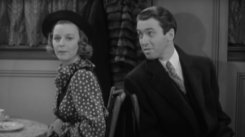 Margaret Sullivan and Jimmy Stewart smiling