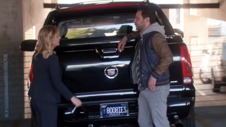 Leslie and the Douche next to the boobies license plate