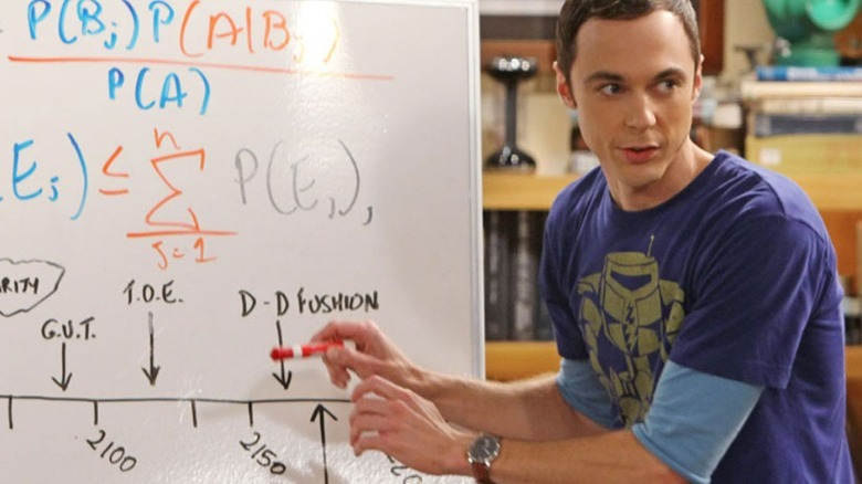 Sheldon writing on a white board