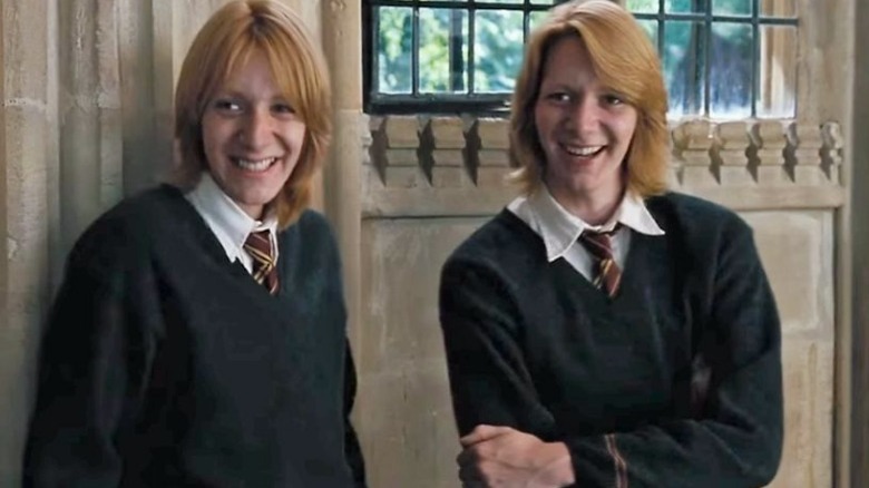 Fred and George Weasley smiling