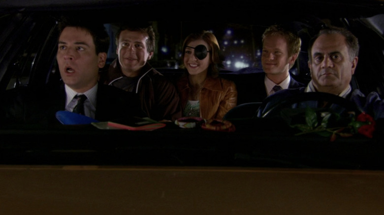 Ted, Marshall, Lily, Barney, and Ranjit in a cab