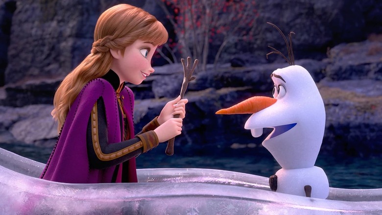 Anna holds Olaf's hand