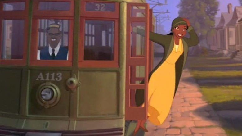 Tiana riding on trolley