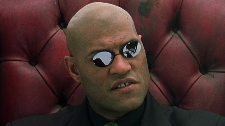 Morpheus sitting on the red chair 