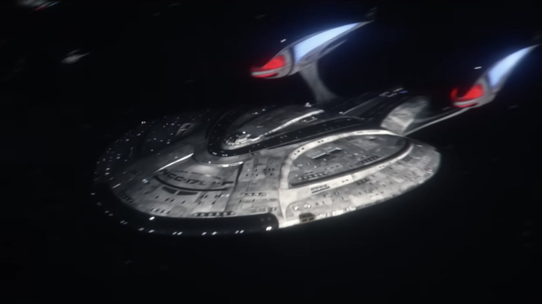 The Enterprise F flies left