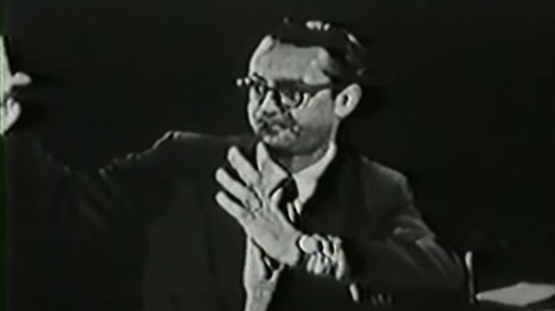 Steve Allen holds up hands