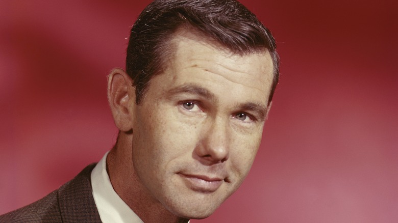 Young Johnny Carson staring