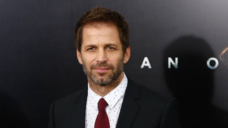 Zack Snyder wearing a suit and tie