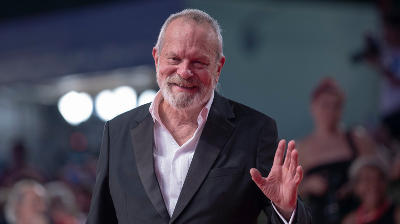 Terry Gilliam smiling and waving