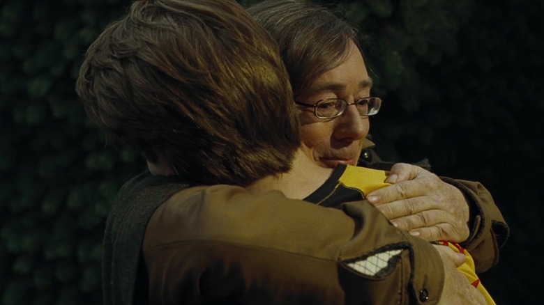 Amos Diggory hugging Cedric Diggory