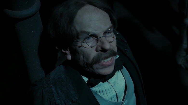 Professor Flitwick grinning 