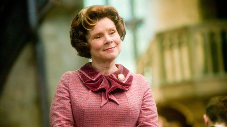 Dolores Umbridge smiling in pink 