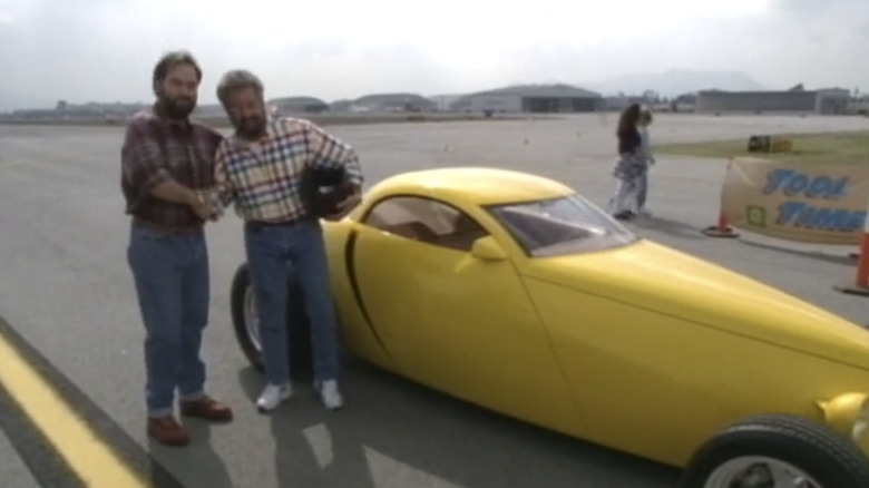 Bob Vila shaking hands with Al in Home Improvement 