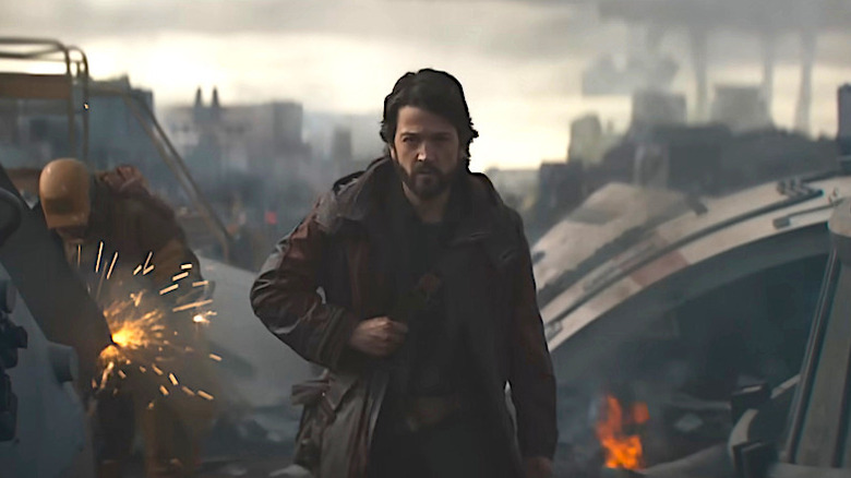 Cassian Andor walking through a junkyard