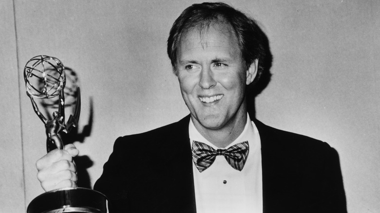 John Lithgow holding award