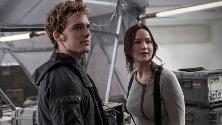 Finnick and Katniss looking to the side