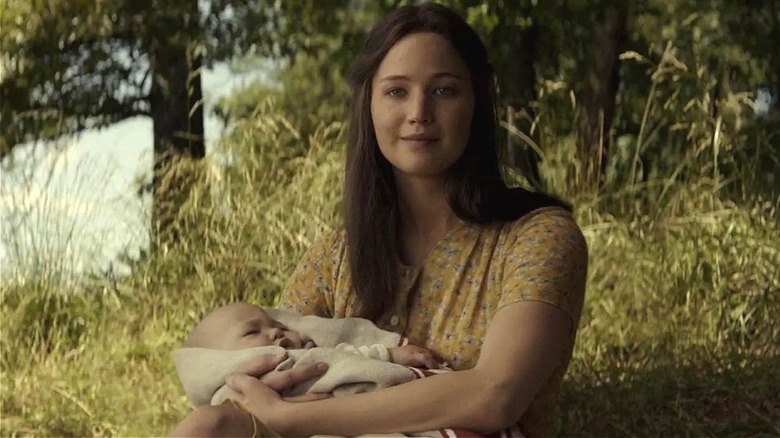 Katniss holding her baby at the end of Mockingjay (2015)