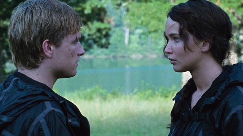 Katniss and Peeta looking at each other in Catching Fire