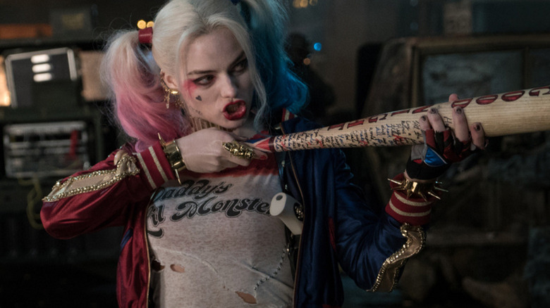 Harley Quinn pointing her bat