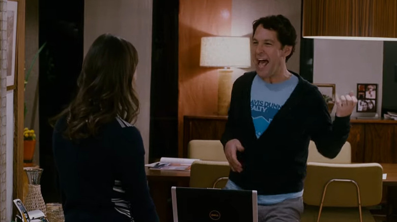 Paul Rudd enthusiastically demonstrating to Rashida Jones what slapping the bass is