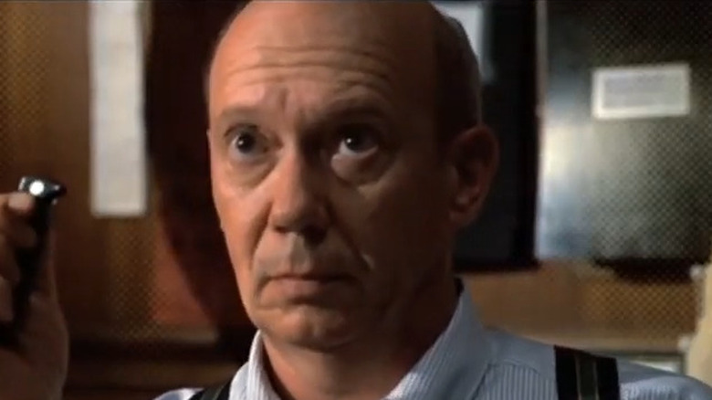 Dann Florek as Cragen, looking somber