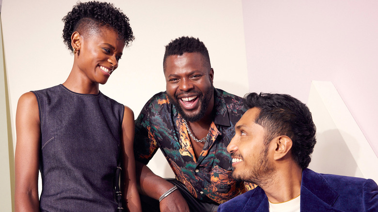 Huerta poses with Wakanda Forever co-stars Winston Duke and Letitia Wright 