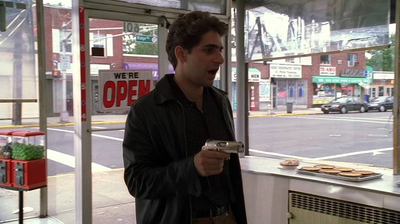 Christopher Moltisanti points gun in bakery