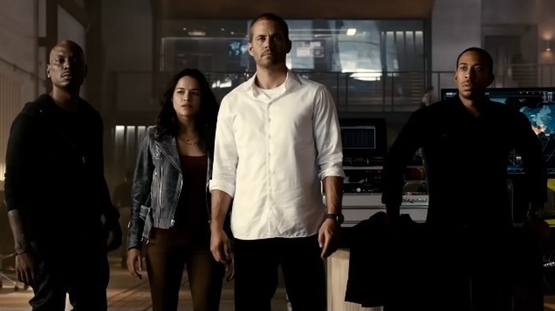 Roman, Letty, Brian and Tej standing together