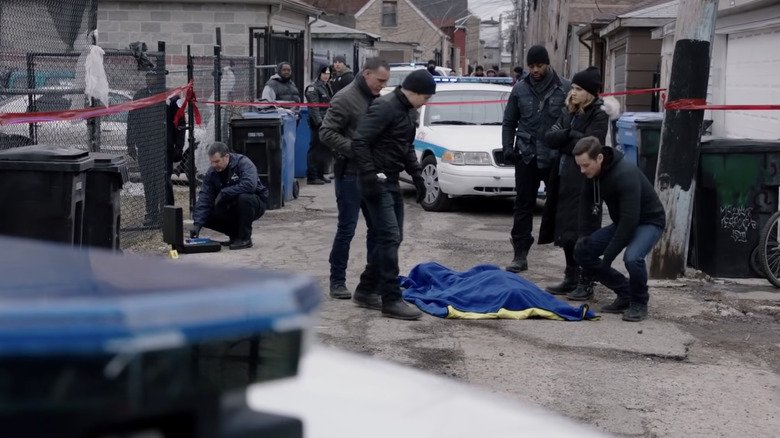 Intelligence officers at a crime scene