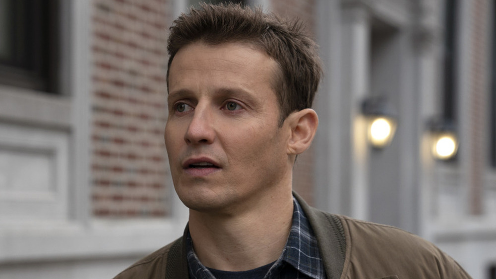 Will Estes wearing plaid shirt