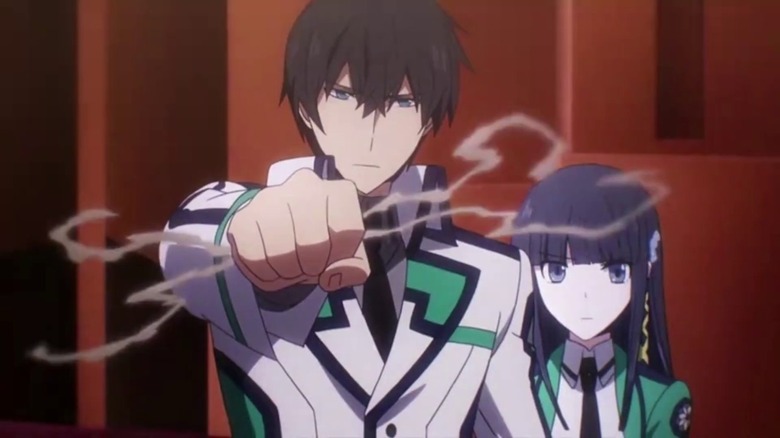 Tatsuya with his fist raised