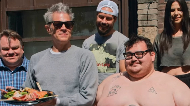 Johnny Knoxville with a plate of Sashimi next to Preston Lacey, Chris Pontius, Zach Holmes and Rachel Wolfson