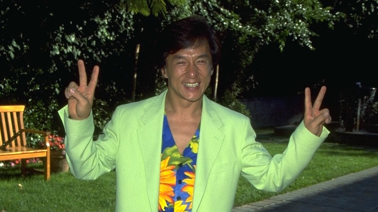 Jackie Chan making peace signs