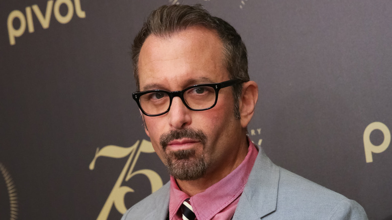 Andrew Jarecki glasses grey suit