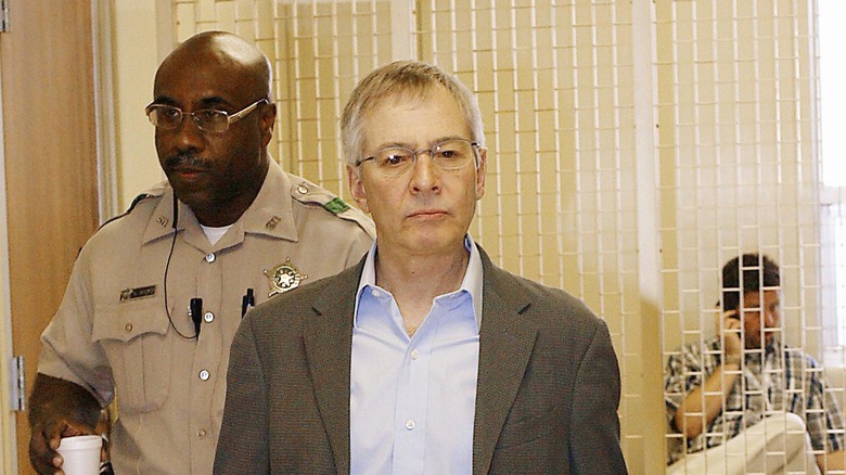 Robert Durst escorted by officer