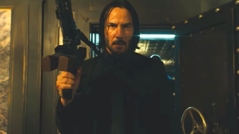 John Wick holding a gun