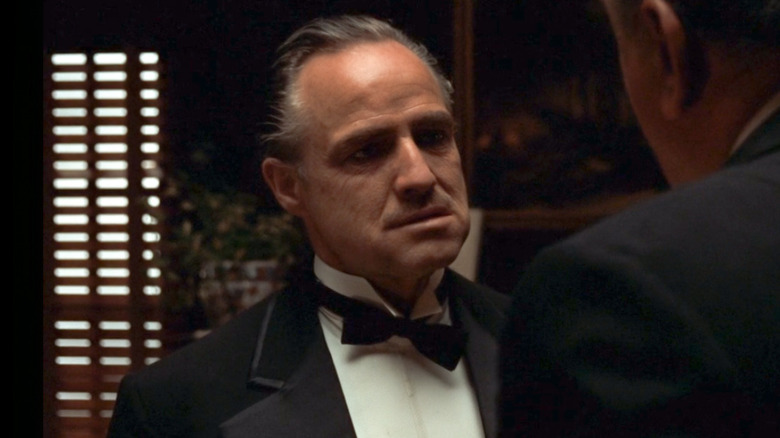 Vito Corleone talking to Luca Brasi