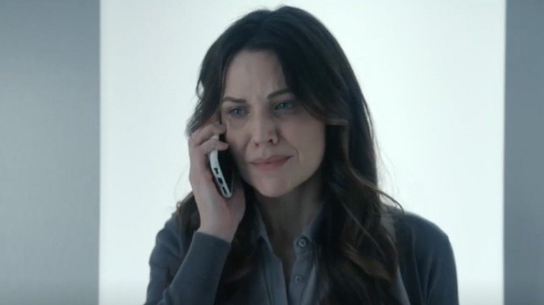 Kate Siegel on phone looking scared in Hypnotic