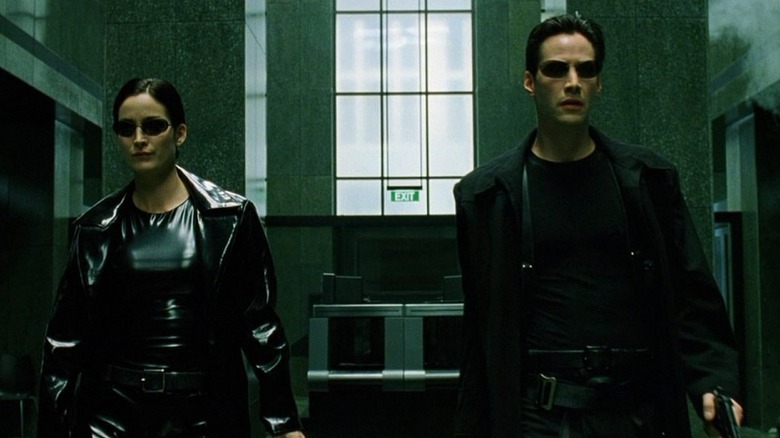 The Matrix Neo and Trinity walk through lobby