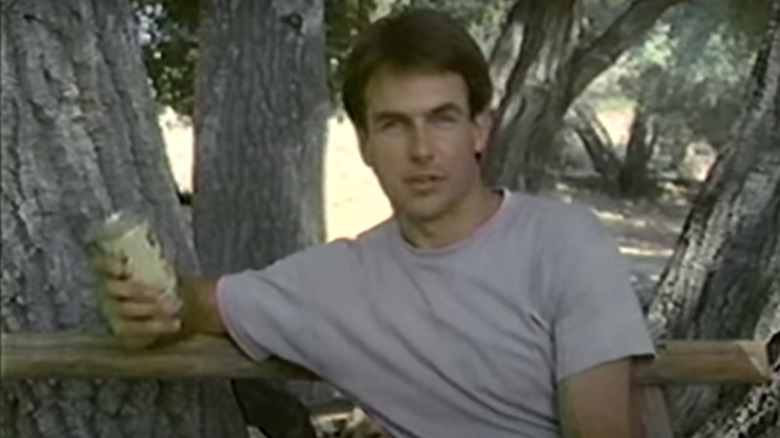 Mark Harmon holding a Coors beer