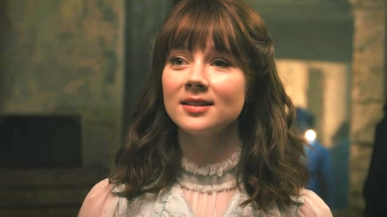 Claudia Jesse as Eloise smiling in Bridgerton