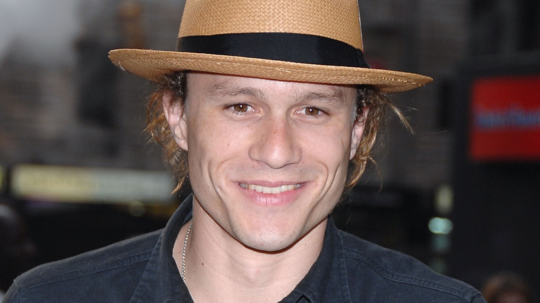 Heath Ledger smiling in hat