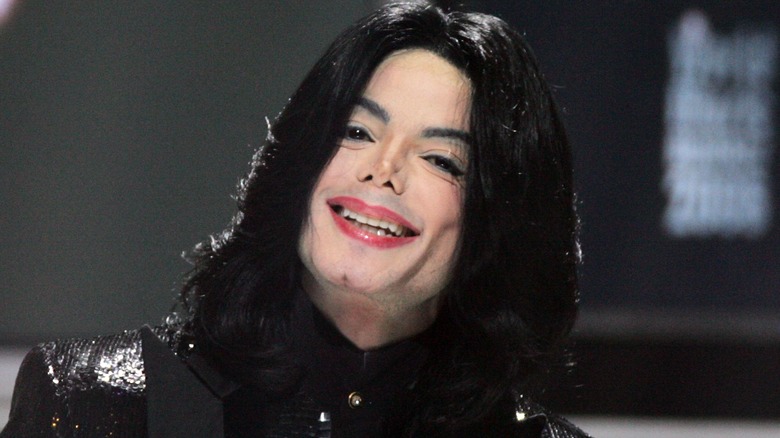 Michael Jackson smiling wearing black