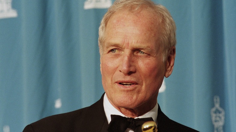 Paul Newman holding Academy Award