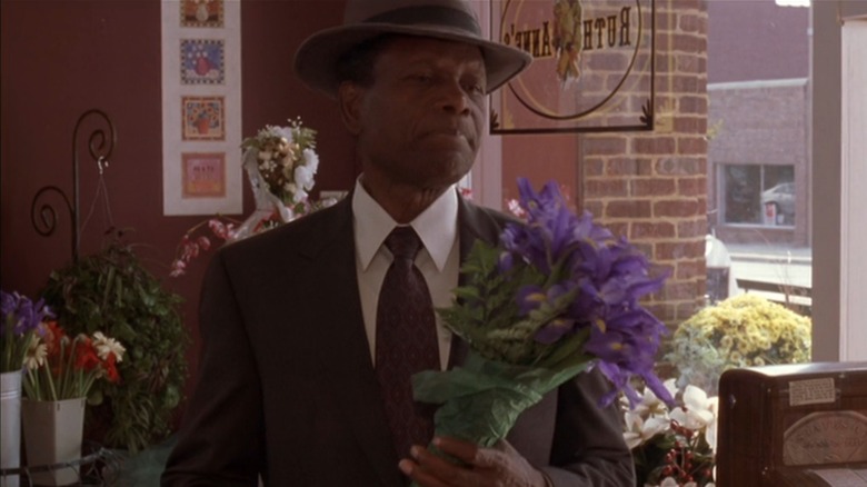 Sidney Poitier in a black suit