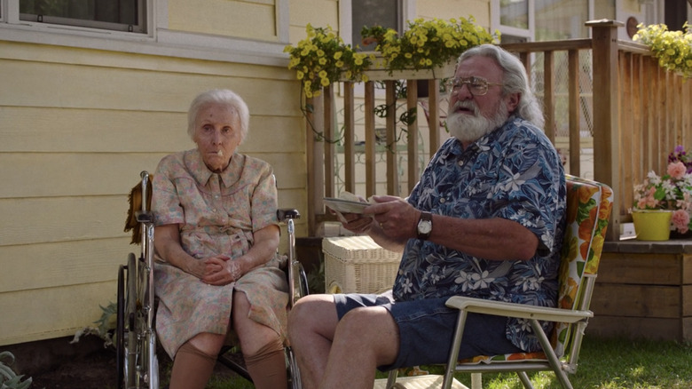 Mr. Adler feeding Nana biscuits